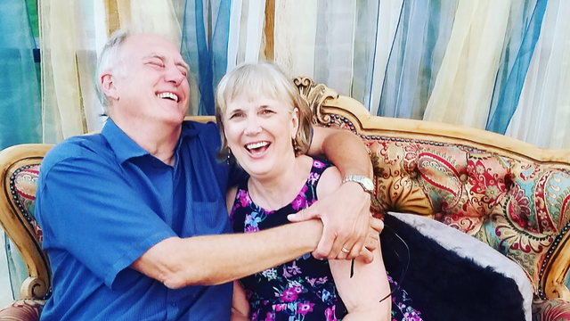 Linda and Mark laughing together